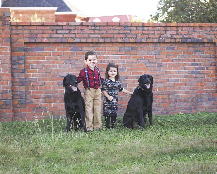 Children with black labs