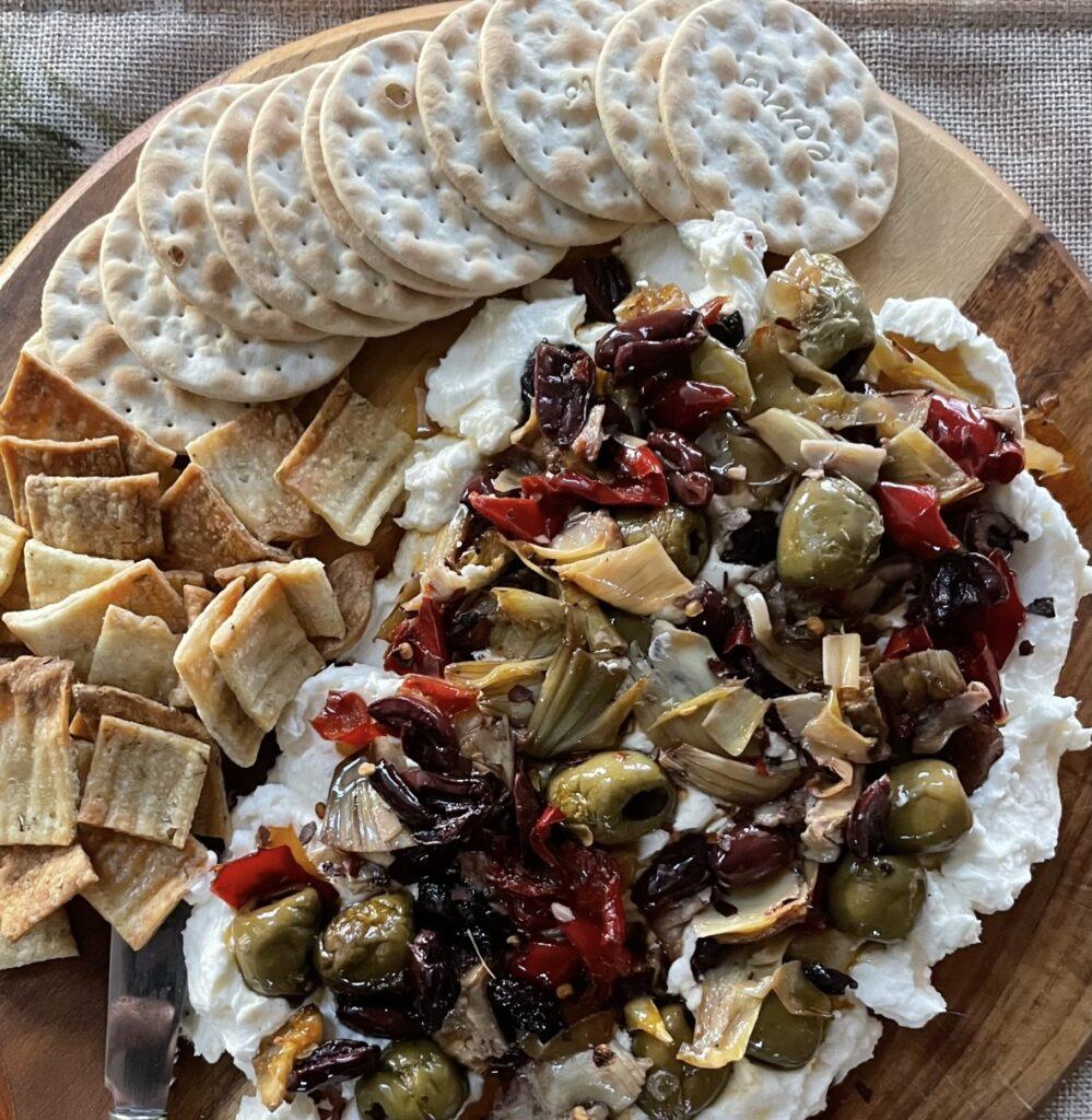 Creamy Feta, Olive, Artichoke, and Roasted Red Pepper Butter Board