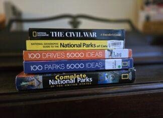 How to Build Your Base Bucket List stack of 5 travel guide books