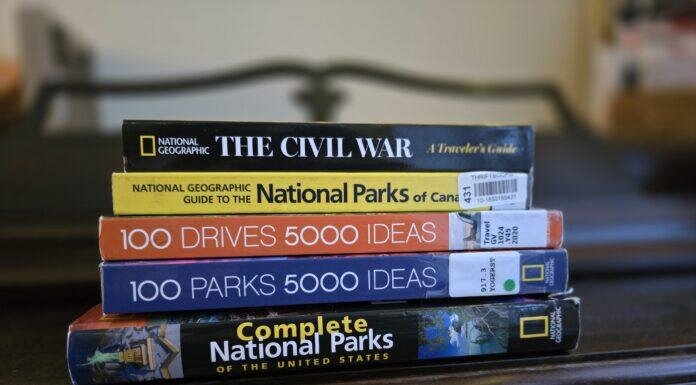 How to Build Your Base Bucket List stack of 5 travel guide books