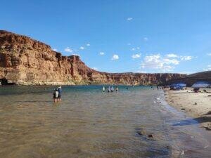 people wading in the Colorado River in Northern Arizona