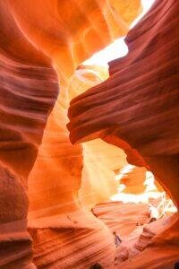 sunlight filters down through a slot canyon in Antelope Canyon in Northern Arizona