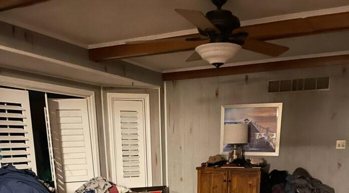 Picture of a messy living room, laundry everywhere, that obviously belongs to a burnt-out mom