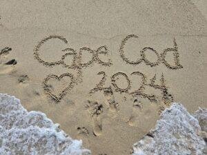 Cape Cod 2024 written in the sand