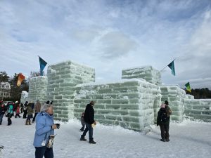 Ice castle with visitors in the foreground