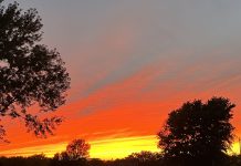 Motherhood is Heartbreaking Sky on fire photo by Kara Sepulveda