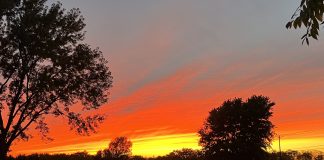 Motherhood is Heartbreaking Sky on fire photo by Kara Sepulveda
