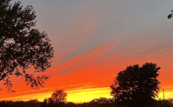 Motherhood is Heartbreaking Sky on fire photo by Kara Sepulveda