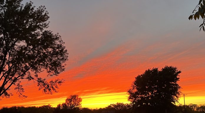 Motherhood is Heartbreaking Sky on fire photo by Kara Sepulveda