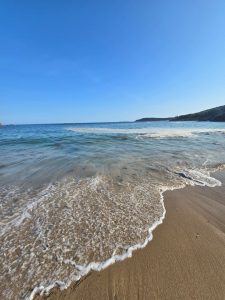 Wave coming in on sandy beach in Acadia National Park