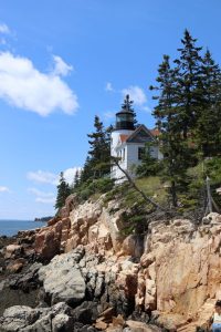 Lighthouse on rocky shore in Acadia National Park